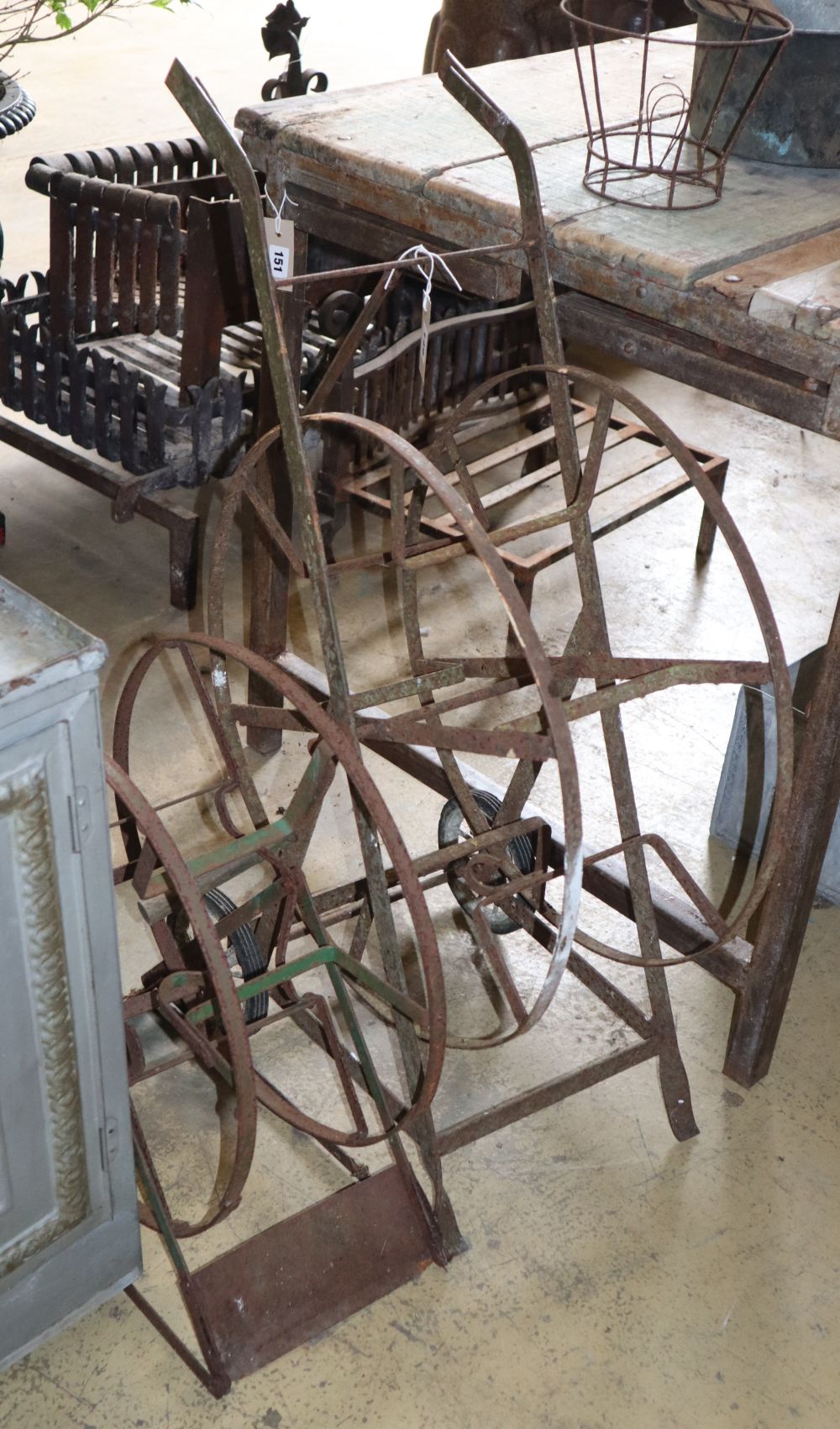 Two garden hose reels, larger H.90cm